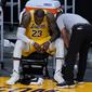 Forward Los Angeles Lakers, LeBron James, setelah timnya tersingkir dari babak play-off NBA melawan Phoenix Suns di Staples Center, Jumat (4/6/2021). (AP/Ashley Landis).
