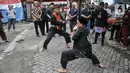 Kesenian palang pintu saat menyambut kedatangan tamu dalam acara Halalbihalal dan Pagelaran Seni Budaya di Asrama Polisi Cideng Barat, Gambir, Jakarta Pusat, Minggu (28/5/2023). (merdeka.com/Iqbal S Nugroho)