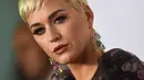 Ekspresi Katy Perry saat tiba menghadiri pesta Gala Musicares Person of The Year 2019 di Los Angeles, AS (8/2). Katy Perry tampil menawan mengenakan gaun hitam bermotif kembang dengan belahan hingga paha terbuka. (AFP Photo/Valerie Macon)