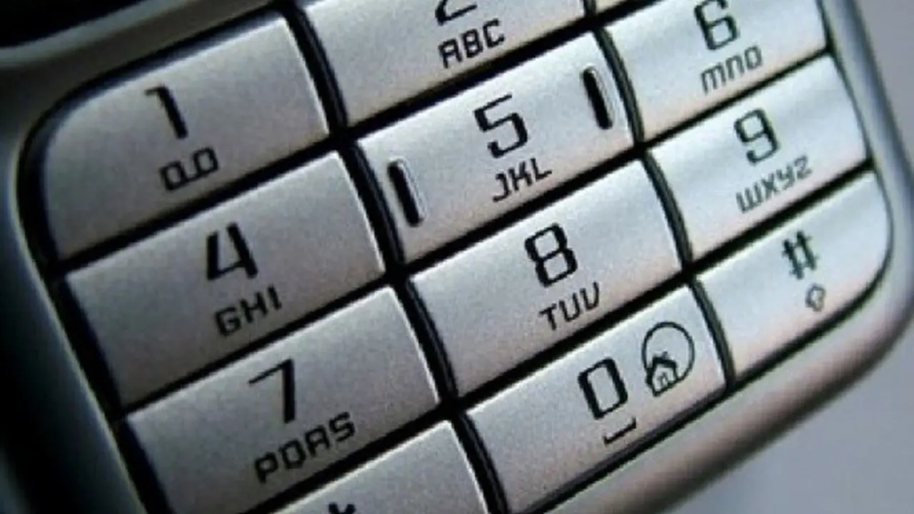  A mobile phone with the number pad in focus. The keypad has the numbers 1 to 9, the letters A to Z, and the symbols * and #.
