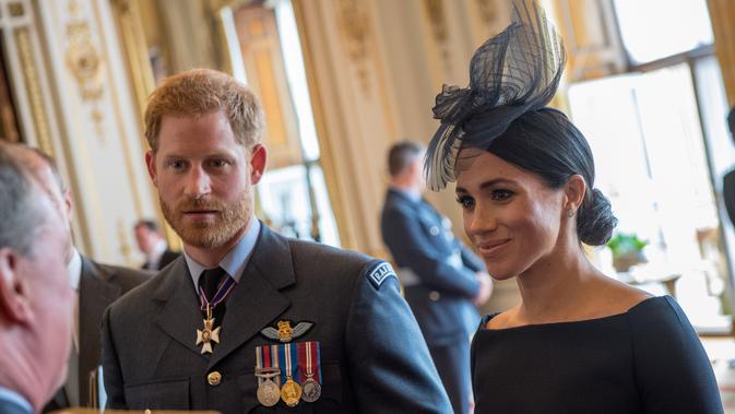Pangeran Harry dan Meghan Markle. (CHRIS J RATCLIFFE / POOL / AFP)