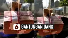 Jika biasanya gantungan mobil dihiasi oleh aksesoris lucu dan menarik. Lain halnya dengan yang dilakukan pria satu ini. Ia menaruh segepok uang dengan nominal besar, sebagai gantungan aksesoris mobilnya. Hal ini pun mengundang reaksi warganet.
