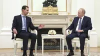 Presiden Rusia Vladimir Putin dan Presiden Suriah Bashar al-Assad saat bertemu di Kremlin, Moskow, pada Rabu (24/7/2024). (Dok. Valery Sharifulin, Sputnik, Kremlin Pool Photo via AP)