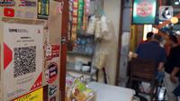 Penetapan tarif ini bertujuan untuk menjaga keberlanjutan penyelenggaraan layanan transaksi pembayaran untuk masyarakat, khususnya untuk menutupi biaya yang timbul dari penyediaan layanan QRIS. (Liputan6.com/Johan Tallo)