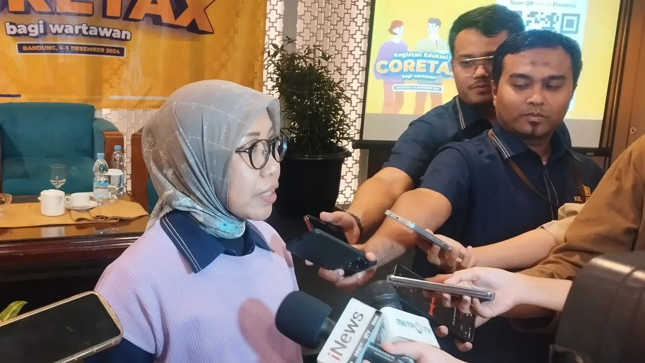 Direktur Penyuluhan, Pelayanan, dan Hubungan Masyarakat Direktorat Jenderal Pajak Dwi Astuti menjelaskan mengenai Coretax kepada wartawan, Rabu (4/12/2024). (Gagas/Liputan6.com)