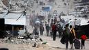 Sementara itu, Badan Pertahanan Sipil Gaza mengatakan, pada 16 Mei 2025, bahwa 50 orang telah terbunuh dalam serangan Israel di wilayah Palestina sejak tengah malam. (Bashar TALEB/AFP)