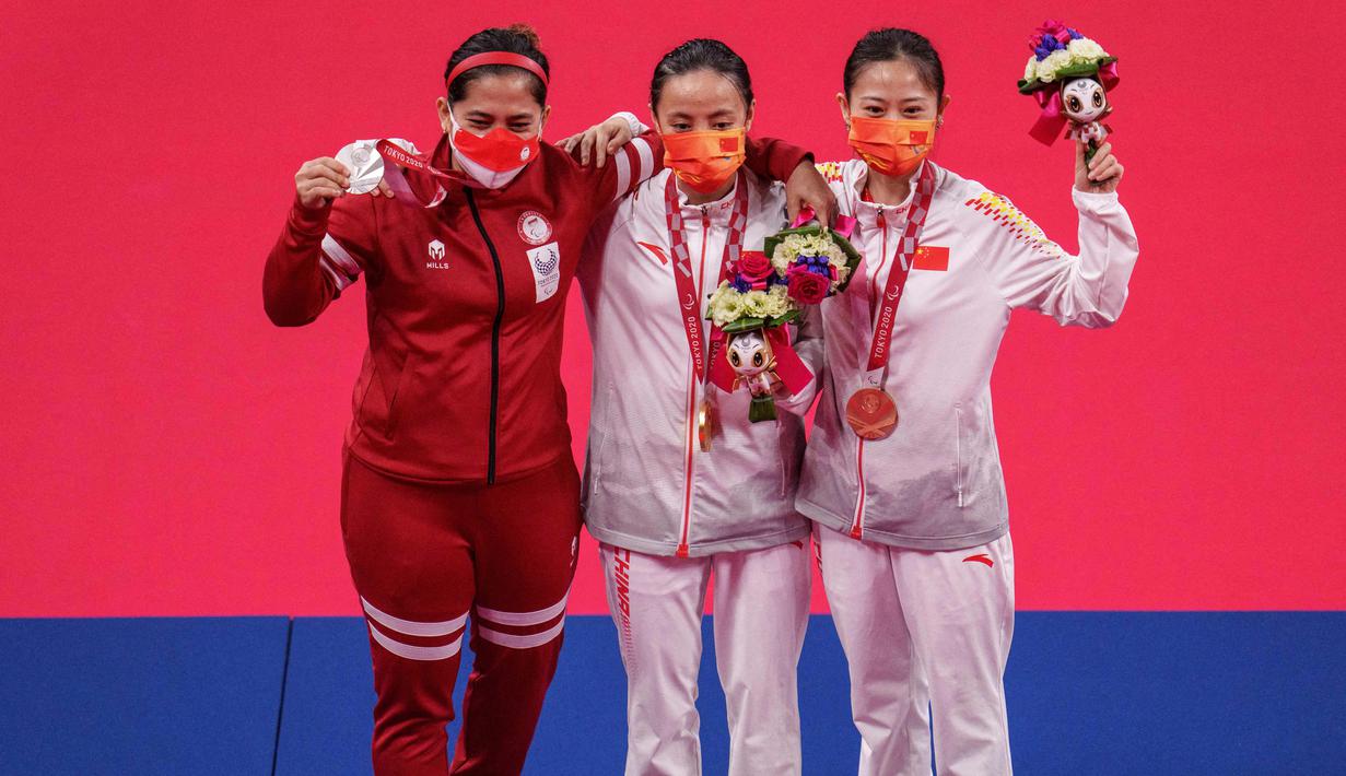 Leani Ratri Oktila kembali naik podium dengan mendapatkan medali perak pada laga final tunggal putri SL4 cabang olahraga bulutangkis Paralimpiade Tokyo 2020 di Yoyogi National Stadium, Minggu (5/9/2021) pagi WIB. (Foto: AFP/OIS/IOC/Joe Toth)
