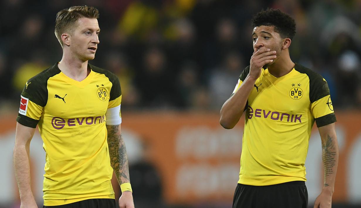 Borussia Dortmund - Gelandang asal Inggris, Jadon Sancho, telah menyumbangkan 14 gol dan Marco Reus 11 gol. Total keduanya telah menyumbangkan 25 gol bagi Dortmund di kompetis Bundesliga musim ini. (AFP/Christof Stache)