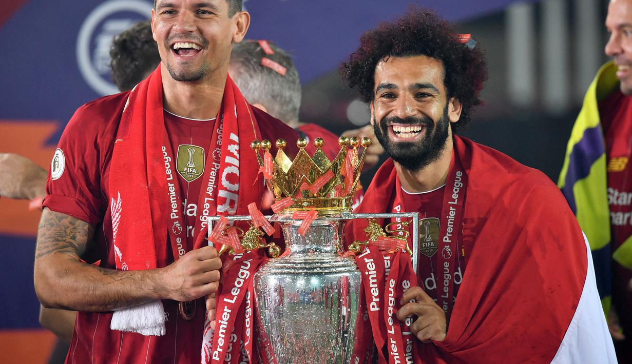Kontribusi Mohamed Salah di lini serang sukses mengantarkan Liverpool mengakhiri puasa gelar Liga Inggris selama 30 tahun terakhir pada musim 2019/2020. The Reds berhasil mendulang 99 poin dan 19 gol diantaranya diciptakan oleh winger asal Mesir tersebut. (AFP/Paul Ellis)