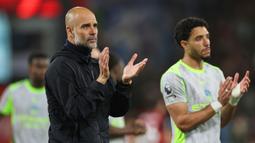 Meski masih tersisa satu pertandingan di Liga Inggris, skuad asuhan Pep Guardiola tak akan mampu menyusul raihan poin Arsenal. Mereka terpaut empat poin di klasemen sementara. (AP Photo/Ian Walton)
