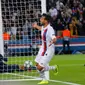 Bek Paris Saint-Germain (PSG), Juan Bernat berselebrasi setelah Thomas Meunier mencetak gol ketiga untuk timnya, ke gawang Real Madrid pada laga Grup A Liga Champions di Parc des Princes, Rabu (18/9/2019). PSG berhasil menaklukkan tamunya Real Madrid 3-0. (AP Photo/Michel Euler)