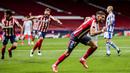 Gelandang Atletico Madrid, Yannick Carrasco melakukan selebrasi usai mencetak gol pertama timnya ke gawang Real Sociedad dalam laga lanjutan Liga Spanyol 2020/2021 pekan ke-36 di Wanda Metropolitano Stadium, Rabu (12/5/2021). Atletico menang 2-1 atas Sociedad. (AP/Bernat Armangue)