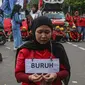 Gerakan aliansi buruh bersama rakyat melakukan aksi teatrikal saat berunjuk rasa menolak pemberlakuan program Tabungan Perumahan Rakyat (Tapera) di Jakarta, Kamis (27/6/2024). (Liputan6.com/Angga Yuniar)