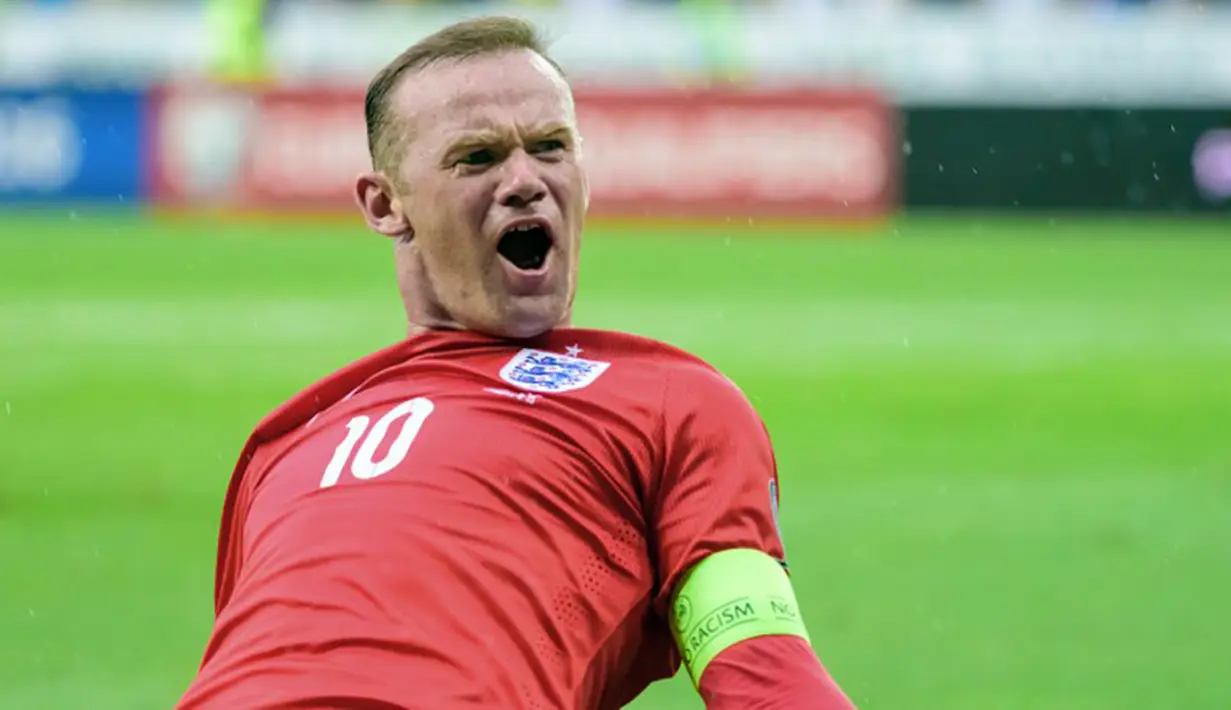 Wayne Rooney merayakan gol ke gawang Slovenia pada laga penyisihan Piala Eropa di Stadion Stozice, Slovenia, Minggu (14/6/2015). (AFP Photo/Jure Makovec)