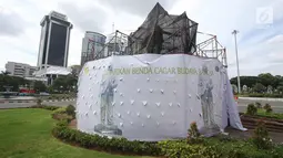 Suasana proses konservasi pada Patung Mohammad Husni Thamrin di Jakarta, Sabtu (25/11). Konservasi dilakukan untuk melestarikan cagar budaya serta merawat patung agar kondisinya tetap baik. (Liputan6.com/Immanuel Antonius)