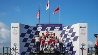 Pembalap binaan PT. Astra Honda Motor (AHM) Afridza Munandar (kanan) berhasil meraih podium ketiga pada balapan kedua di ajang Asia Talent Cup (ATC) 2019 seri keempat, di Chang International Circuit, Buriram, Thailand (5-6/10). (dok. AHM)
