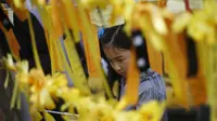 Taman Pita Kuning pita kuning yang didedikasikan untuk penumpang yang hilang dan mati dari kapal Sewol. (REUTERS/Kim Hong-Ji)