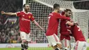 <p>Pemain Manchester United Bruno Fernandes (kedua kanan) merayakan gol ke gawang Brentford pada pertandingan sepak bola Liga Inggris di Stadion Old Trafford, Manchester, Inggris, 2 Mei 2022. Manchester United menang 3-0. (AP Photo/Jon Super)</p>