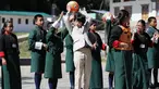Pangeran Hisahito (tengah) berusia 12 tahun dari Jepang mengoper bola saat bermain bersama siswa setempat saat mengunjungi sebuah sekolah di Thimpu, Bhutan, Selasa (20/8/2019). (AFP Photo/Japan Out/Jiji Press)