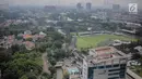 Sejumlah gedung bertingkat berada di antara ruang terbuka hijau (RTH) di kawasan Jakarta, Sabtu (6/4). Dinas Kehutanan DKI Jakarta mengganggarkan Rp 1,5 triliun untuk pengadaan tanah dengan peruntukan Ruang Terbuka Hijau (RTH) di tahun 2019. (Liputan6.com/Faizal Fanani)