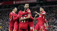 Pemain Liverpool Cody Gakpo merayakan mencetak gol pertama tim mereka dalam pertandingan tersebut saat menghadapi Manchester City di Stadion Anfield, Liverpool, Inggris, Minggu 1 Desember 2024. (Peter Byrne/PA melalui AP)