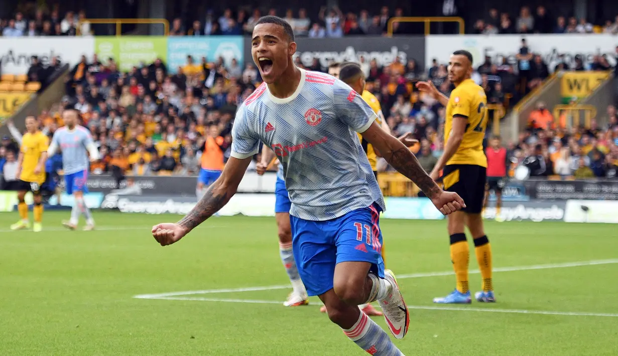Manchester United sukses membawa poin tiga di pekan ketiga Liga Inggris 2021/2022, dari lawatannya ke markas Wolverhampton. Skuat asuhan Solskjaer tersebut memenangkan laga dengan skor tipis 1-0. (Foto: AFP/ Oli Scarff)