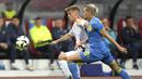 Gelandang Jerman Joshua Kimmich  berebut bola melawan gelandang Ukraina Mykhailo Mudryk dalam laga uji coba jelang Piala Eropa 2024 di Stadion Max Morlock, Nurenberg, Selasa (4/6/2024). (Tom Weller/dpa via AP)