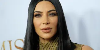 Kim Kardashian terkenal karena bentuk bokongnya dan tubuhnya yang seksi. (CHRIS DELMAS / AFP)