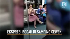 Begini ekspresi seorang bocah laki-laki ketika ada cewek seksi duduk di sampingnya.