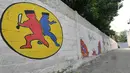 Mural bertemakan Asian Games 2018 menghiasi sebuah tembok di kawasan Jati Padang Utara, Jakarta, Sabtu (12/5). Asian Games ke 18 tersebut akan digelar di Jakarta dan Palembang pada tanggal 18 Agustus 2018 - 2 September 2018. (Liputan6.com/Herman Zakharia)