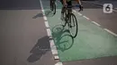 Pesepeda melintas di Jalan Jenderal Sudirman, Jakarta, Minggu (6/6/2021). Gubernur DKI Jakarta Anies Baswedan berencana menambah jalur sepeda sepanjang 101 kilometer di Jakarta pada tahun 2021. (Liputan6.com/Faizal Fanani)