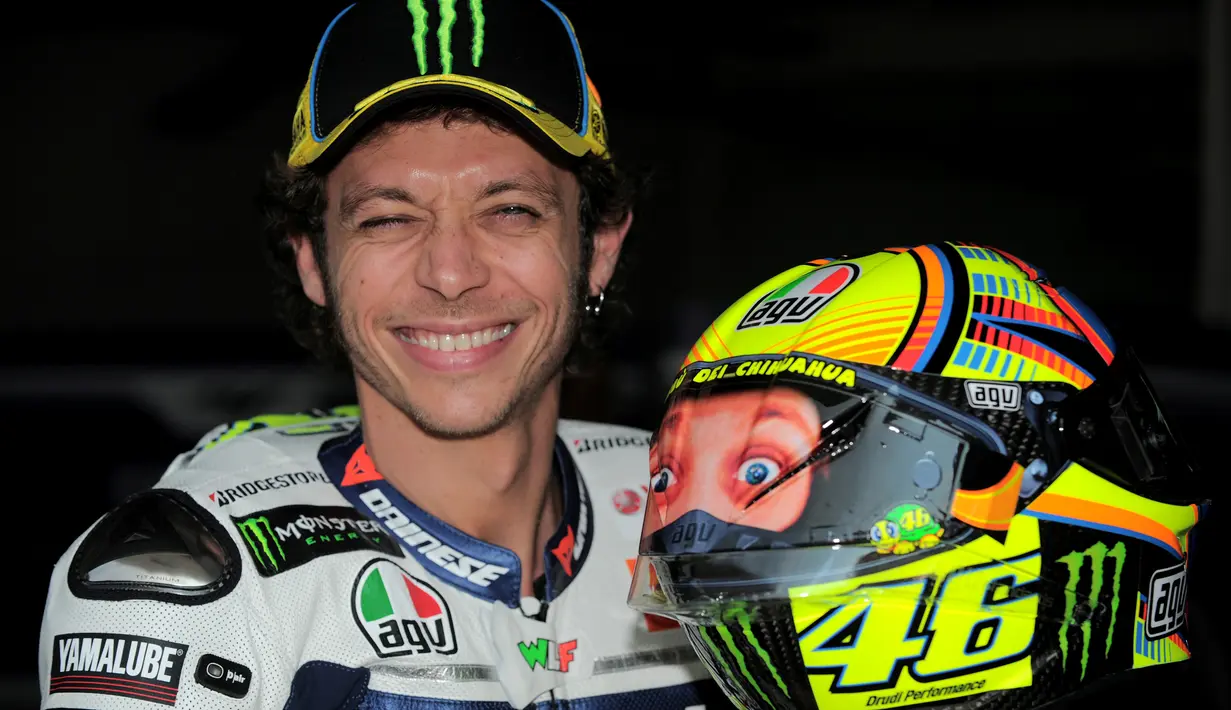 Rossi dengan helm bergambar dirinya tahun 2014. (AFP/Mohd Rasfan)