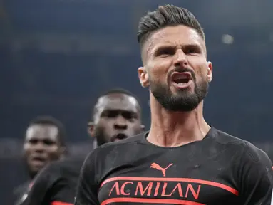AC Milan berhasil menggusur Napoli, yang belum bermain di pekan ke-10, dari puncak klasemen Liga Italia 2021/2022 usai menang tipis 1-0 atas tamunya Torino, Selasa (26/10/2021). Gol tunggal kemenangan Rossoneri dicetak Olivier Giroud pada menit ke-14. (AP/Luca Bruno)