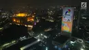 Maskot Asian Games  2018, Kaka terpampang di video mapping atau layar bergerak di Gedung Utama Pertamina, Jakarta, Kamis (5/7). Video akan tayang setiap hari mulai 5 Juli hingga 5 September 2018, pukul 18.00 – 00.00 WIB. (Liputan6.com/Arya Manggala)