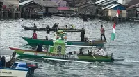 Konvoi perahu warga Pagimana saat menyambut hari raya Idulfitri (Arfandi/Liputan6.com)