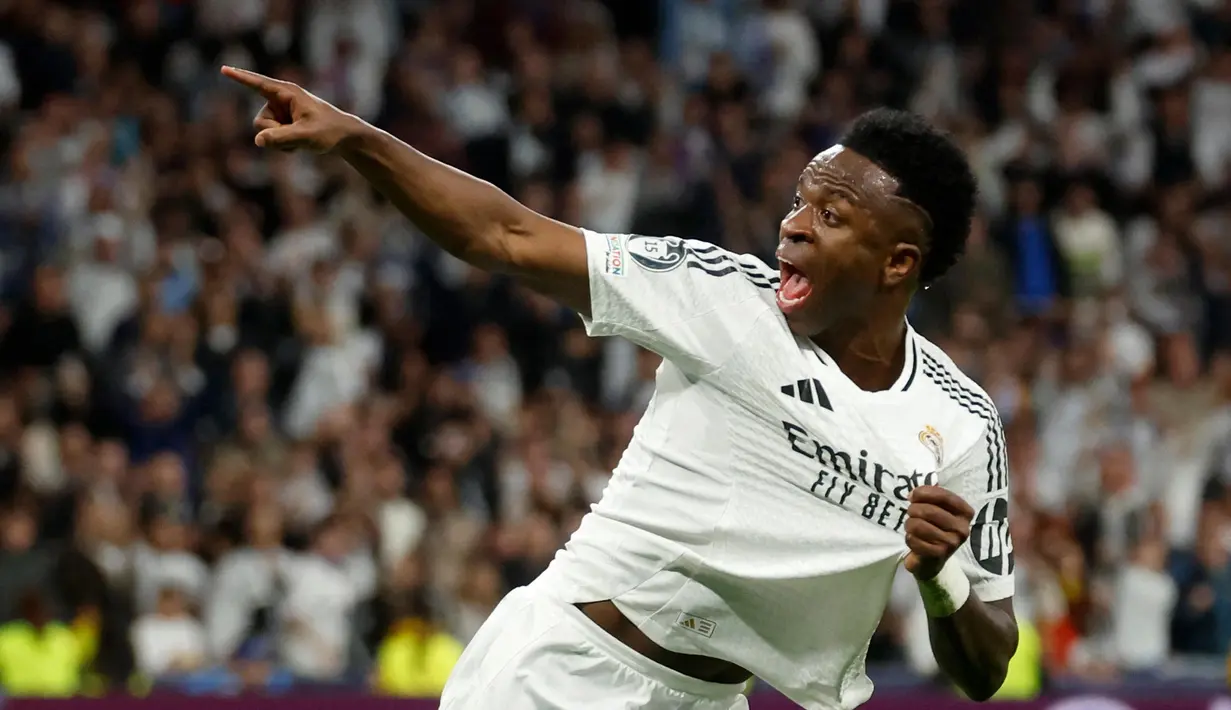 Dua menit berselang, Vinicius Junior berhasil mencetak penyeimbang. (Pierre-Philippe MARCOU/AFP)