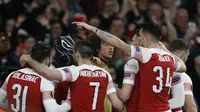 4. Black Panther (Arsenal) - Pada leg kedua babak 16 besar Liga Europa Aubameyang melakukan selebrasi ala Black Panther saat menjebol gawang Rennes. Selebrasi tersebut dilakukan pada gol kedua Auba. (AFP/Ian Kington)