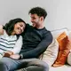 Happy Couple/copyright Pexels.com https://www.pexels.com/photo/smiling-multiracial-couple-hugging-on-couch-6392957/