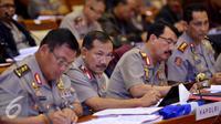 Kapolri Jenderal Badrodin Haiti (kedua kiri) mengikuti rapat kerja dengan Komisi III DPR di Komplek Parlemen, Jakarta, Kamis (02/07/2015). Rapat membahas persiapan pengamanan pilkada, pelaksanaan 11 program prioritas Polri. (Liputan6.com/Andrian M Tunay)