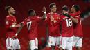 MANCHESTER UNITED BELUM KALAH DI LIMA LAGA: Pemain Machester United merayakan gol yang dicetak Bruno Fernandes ke gawang Leeds United (20/12/2020). Manchester United terus tampil impresif dan belum kalah di lima laga terakhirnya. (AFP/Clive Brunskill/pool)