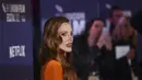Jessica Chastain berpose di depan fotografer saat tiba untuk pemutaran perdana film 'The Good Nurse' selama Festival Film London 2022 di London, Senin, 10 Oktober 2022. Jessica mengenakan gaun oranye yang menampilkan garis leher yang menjuntai dan belahan yang terbuka. (Photo by Vianney Le Caer/Invision/AP)