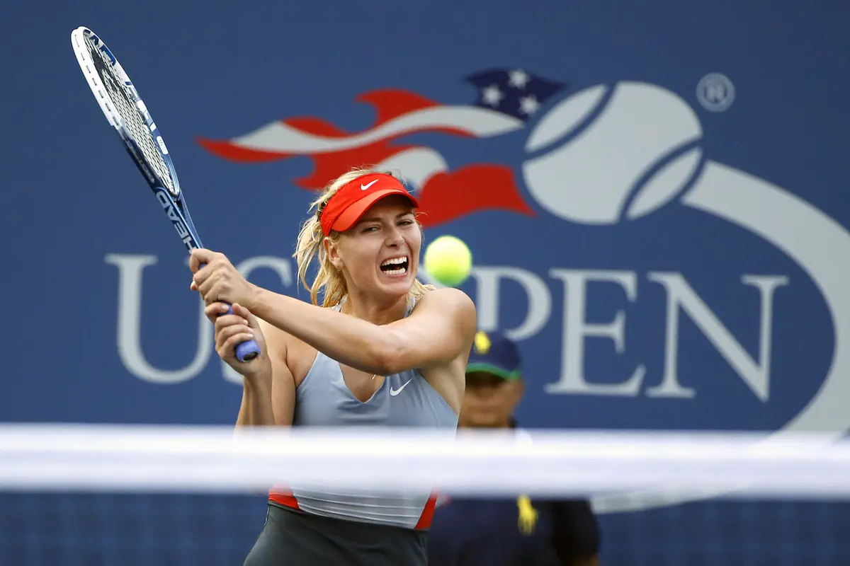 Maria Sharapova saat mengikuti AS Terbuka 2014. Sharapova dijadwalkan menghadapi Simona Halep pada turnamen tahun ini. (AP Photo/Jason DeCrow)