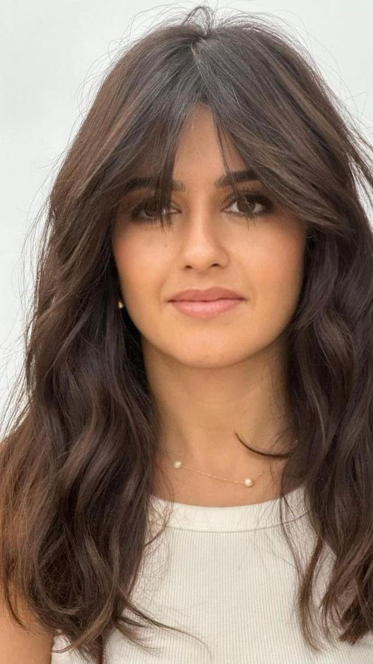 <b>Wavy Cut and Curtain Bangs</b>