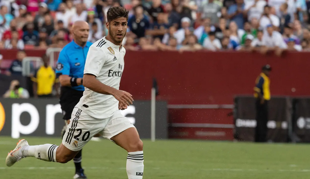 Asensio sudah melakoni 34 laga namun hanya menciptakan enam gol saja. Liverpool dan Tottenham Hotspur dikabarkan tertarik menggaet sang pemain pada transfer musim panas nanti. (AFP/Nicholas Kamm)