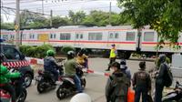 Perlintasan berpalang KRL Stasiun Pondok Cina, Kota Depok. (Istimewa)