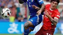 Melawan Italia, Swiss tampil impresif dan tangguh. (AXEL HEIMKEN/AFP)