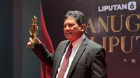 Dirut BPJS Kesehatan, Ali Ghufron Mukti saat menerima Anugerah Liputan6 Kategori Digitalisasi Pelopor Ekosistem Kesehatan Digital Nasional, Jakarta (16/10/2025). Foto: Liputan6.com/Ade Nasihudin.