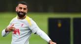 Pemain depan Liverpool, Mohamed Salah bereaksi saat berlatih di tempat latihan tim di Liverpool, barat laut Inggris, pada 16 September 2024. (Peter POWELL/AFP)