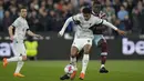 <p>Liverpool meraih kemenangan 2-1 setelah bertandang ke markas West Ham United pada pekan ke-33 Liga Inggris. (AP Photo/Alastair Grant)</p>