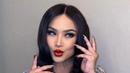 <p>2. Inilah potret Titi DJ dengan makeup bold yang menonjolkan permainan pada area mata dengan bulu mata palsu tebal dan bibir dengan pulasan lipstik merah. (Instagram/ti2dj).</p>